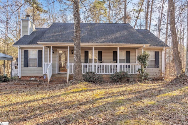 view of front of property with a front yard and covered porch