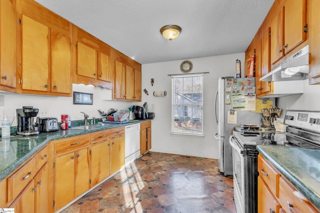 kitchen featuring stainless steel electric range oven, dishwasher, sink, and a textured ceiling