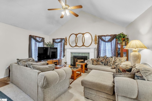 living room with lofted ceiling, a healthy amount of sunlight, a tiled fireplace, and light carpet