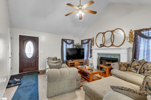 living room with ceiling fan, high vaulted ceiling, and a fireplace