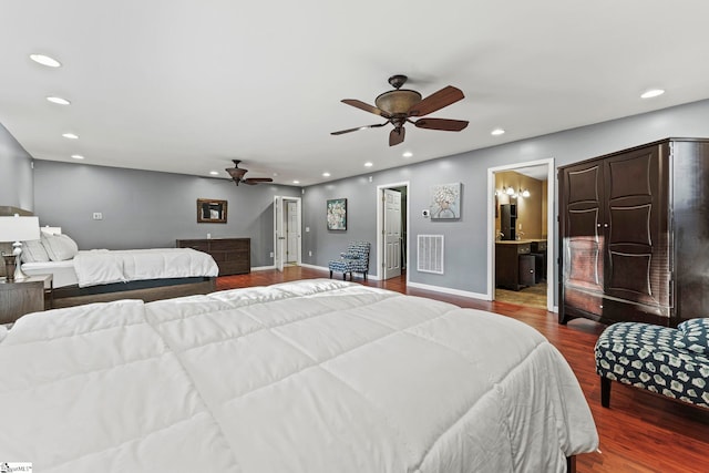 bedroom featuring ceiling fan, wood-type flooring, and connected bathroom