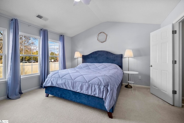 carpeted bedroom featuring vaulted ceiling and ceiling fan