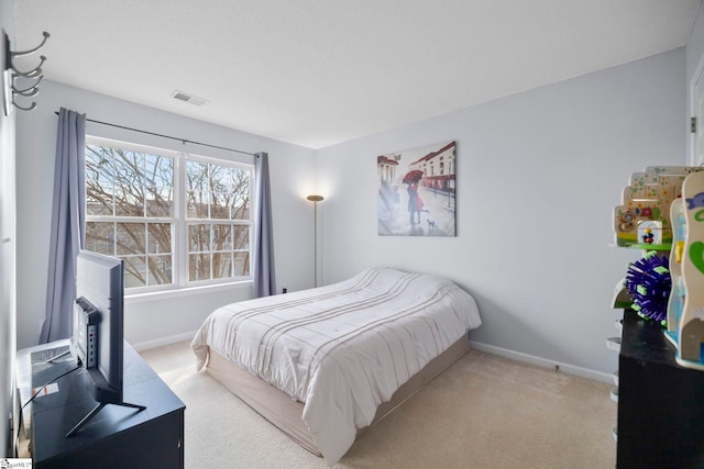 bedroom with light carpet