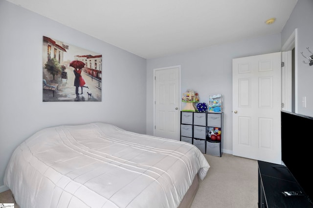 bedroom featuring light carpet