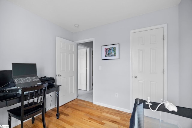 office space with wood-type flooring