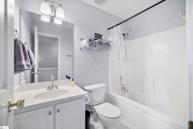 full bathroom featuring shower / bathtub combination with curtain, vanity, and toilet