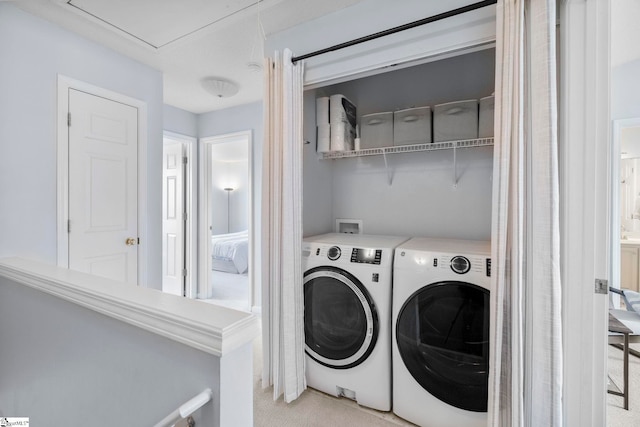 laundry room with separate washer and dryer