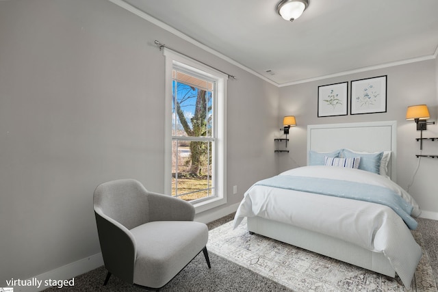 bedroom featuring ornamental molding and carpet flooring