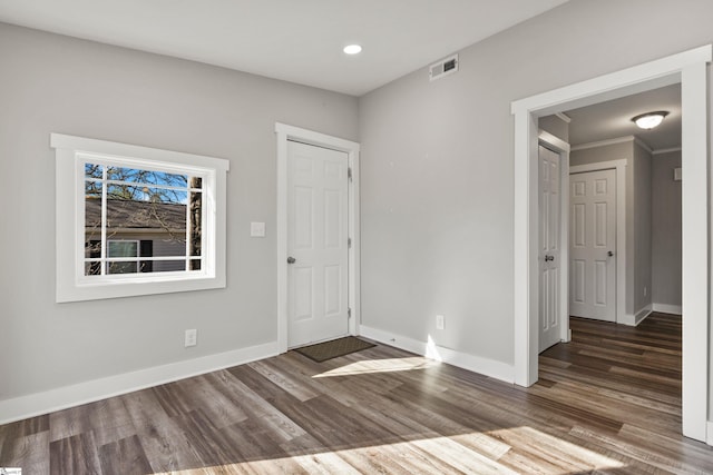 foyer entrance featuring dark hardwood / wood-style flooring