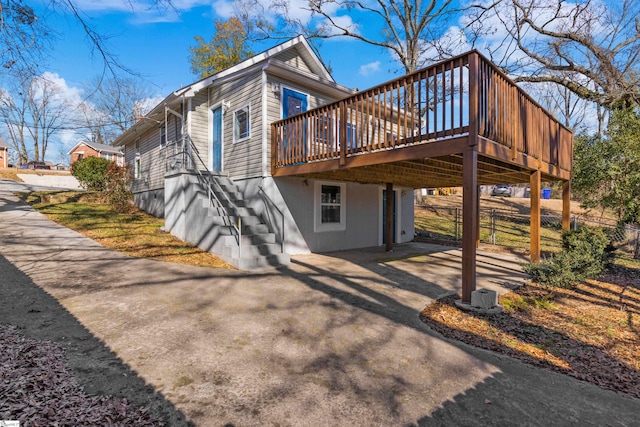 view of property exterior featuring a deck