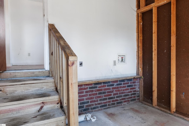 staircase with concrete flooring