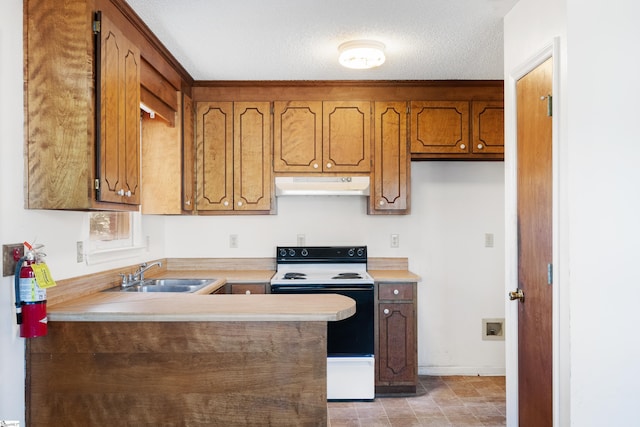 kitchen with range with electric stovetop, sink, a textured ceiling, and kitchen peninsula