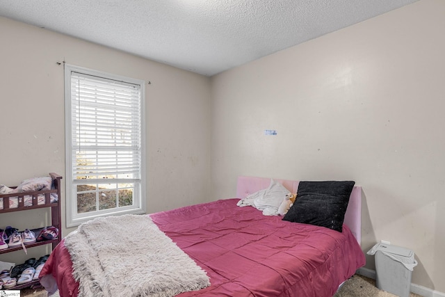 bedroom featuring a textured ceiling