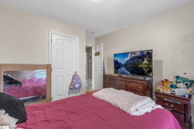 bedroom featuring a textured ceiling