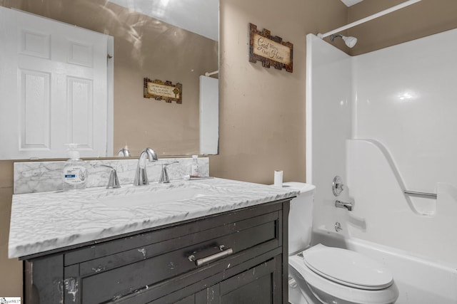 full bathroom with vanity, shower / tub combination, and toilet