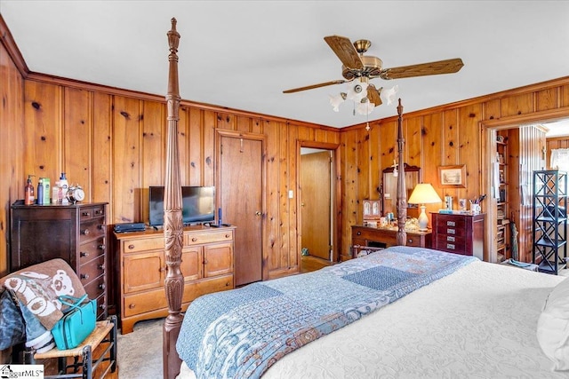 bedroom featuring crown molding, light colored carpet, and wooden walls