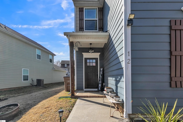 view of exterior entry with central AC unit