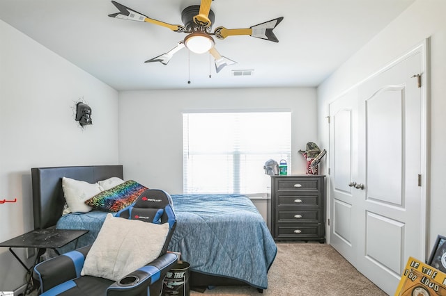 carpeted bedroom featuring ceiling fan