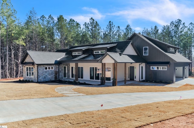 modern farmhouse with a front lawn