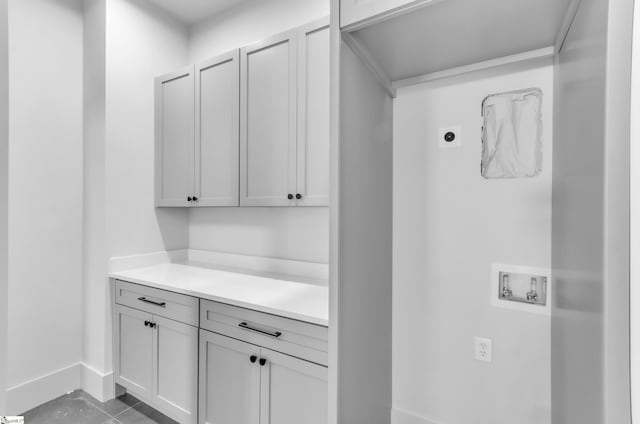 laundry area featuring cabinets, electric dryer hookup, and washer hookup