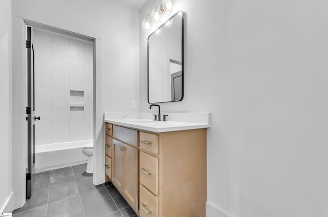 full bathroom featuring vanity, tiled shower / bath combo, tile patterned floors, and toilet