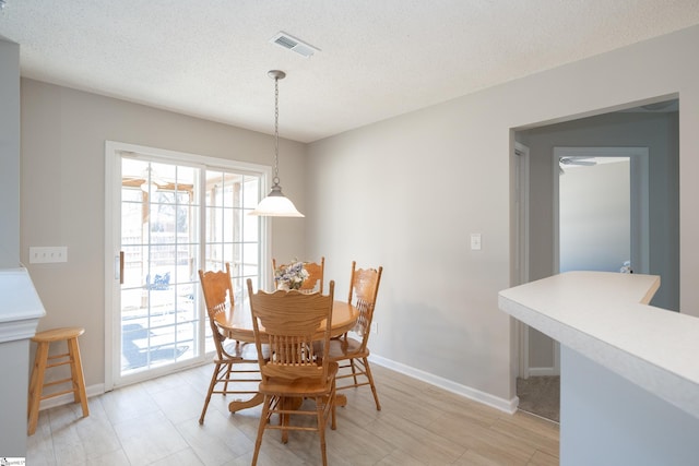 dining room featuring a textured ceiling