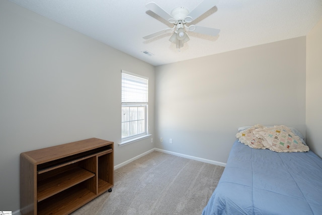 bedroom with ceiling fan and light colored carpet