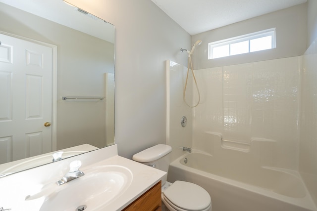 full bathroom with shower / tub combination, vanity, and toilet