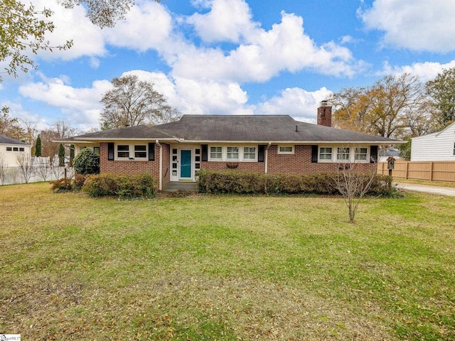 ranch-style home with a front yard