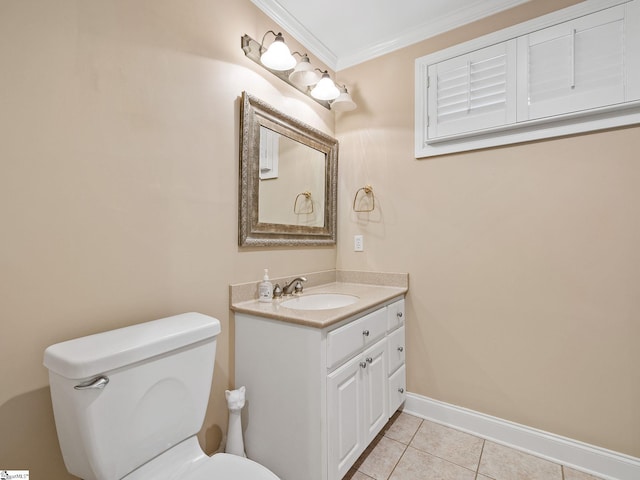 bathroom featuring vanity, crown molding, tile patterned floors, and toilet