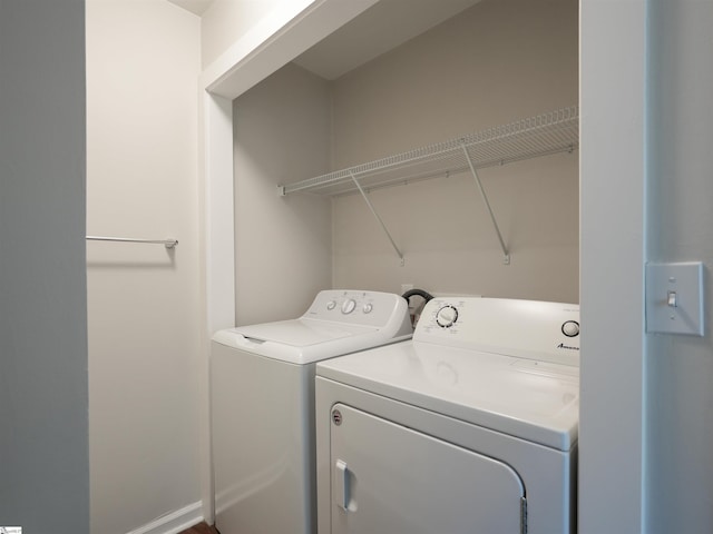 laundry area with separate washer and dryer