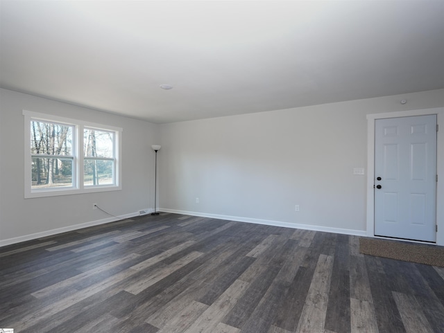 spare room with dark hardwood / wood-style flooring