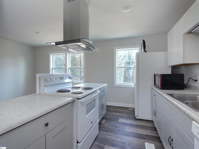 kitchen featuring sink, white cabinetry, island range hood, dark hardwood / wood-style floors, and white appliances