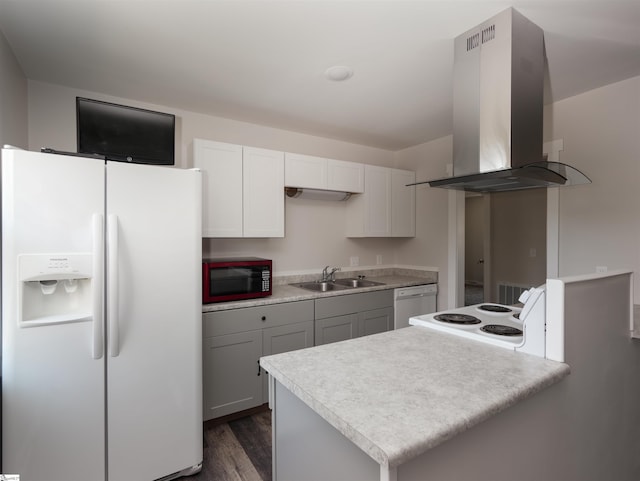 kitchen featuring dark wood-type flooring, sink, island range hood, white appliances, and white cabinets