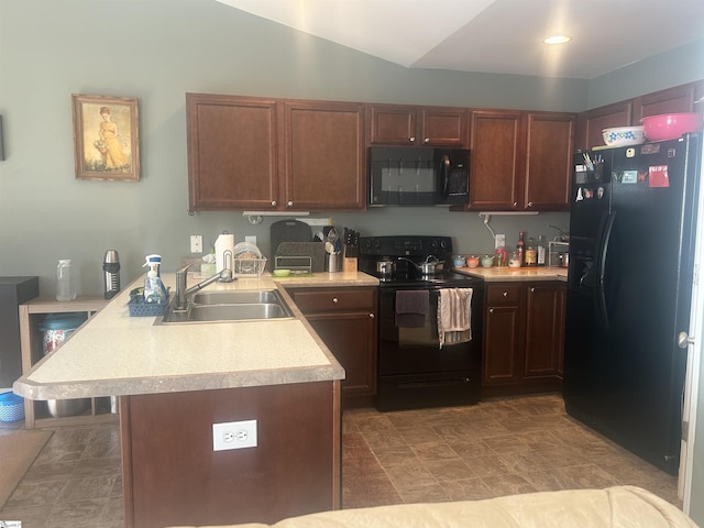 kitchen featuring kitchen peninsula, sink, and black appliances