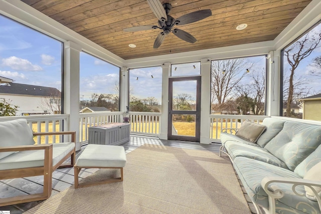 sunroom / solarium with wooden ceiling and ceiling fan