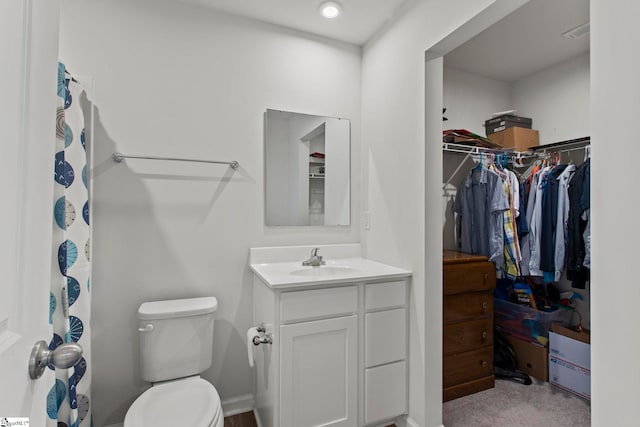 bathroom featuring vanity and toilet