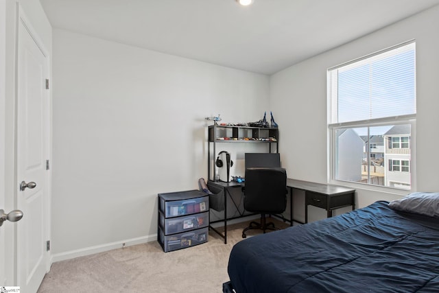 bedroom with light carpet