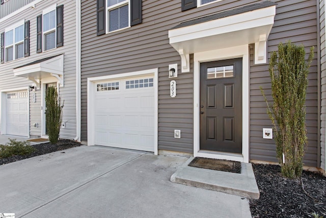 entrance to property featuring a garage