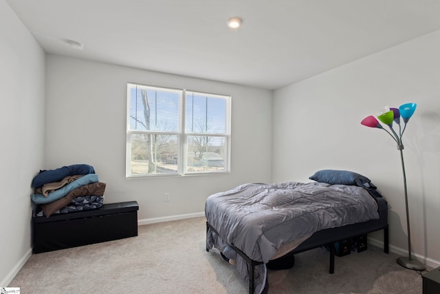 bedroom featuring light carpet