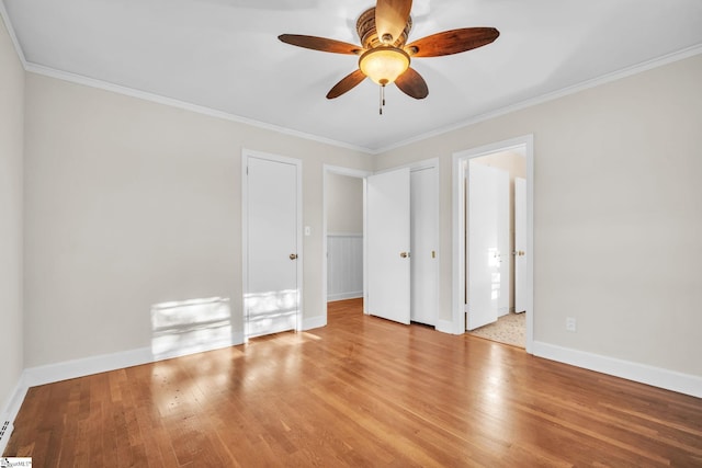 unfurnished bedroom featuring ornamental molding, light hardwood / wood-style floors, and ceiling fan