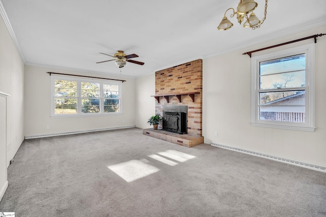 unfurnished living room featuring a baseboard heating unit, ceiling fan with notable chandelier, ornamental molding, and carpet flooring