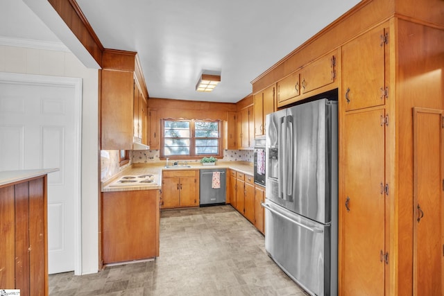 kitchen featuring ornamental molding, stainless steel appliances, and decorative backsplash