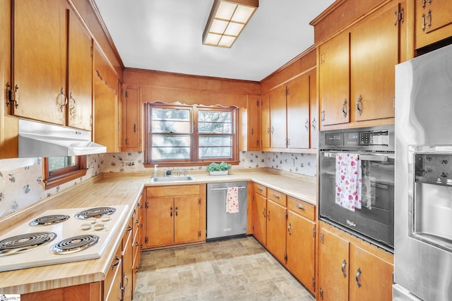 kitchen with sink, backsplash, and stainless steel appliances