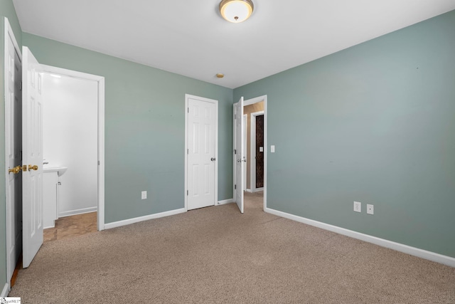 unfurnished bedroom featuring carpet flooring and a closet