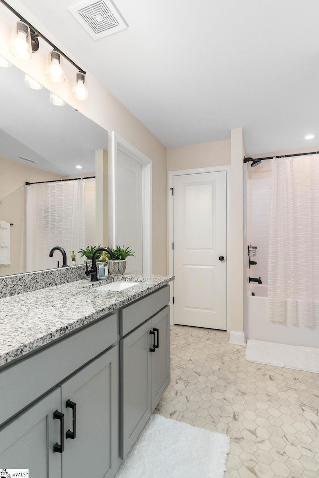 bathroom with vanity and shower / bathtub combination with curtain