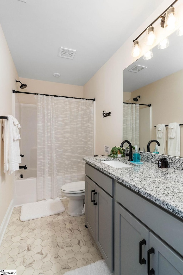 full bathroom featuring vanity, toilet, tile patterned flooring, and shower / tub combo