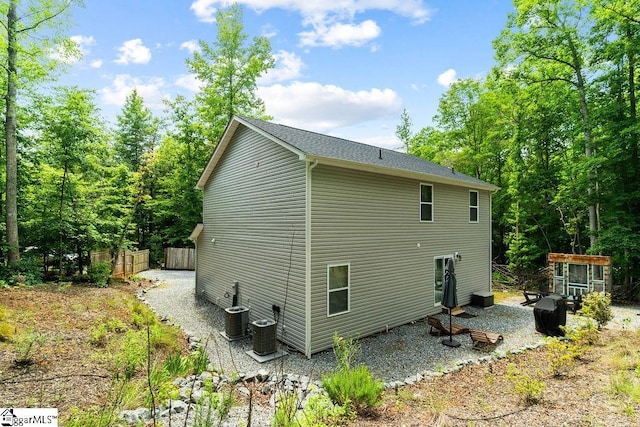 view of side of property featuring central air condition unit