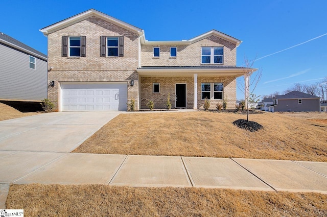 view of front facade with a garage, a front yard, and a porch