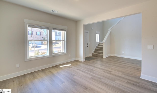 spare room featuring light hardwood / wood-style floors